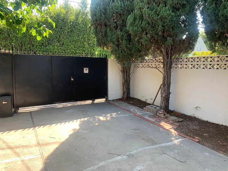 Access parking from the alley through a remote gate.