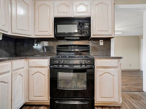 from kitchen, doorway leads to main family/dining area