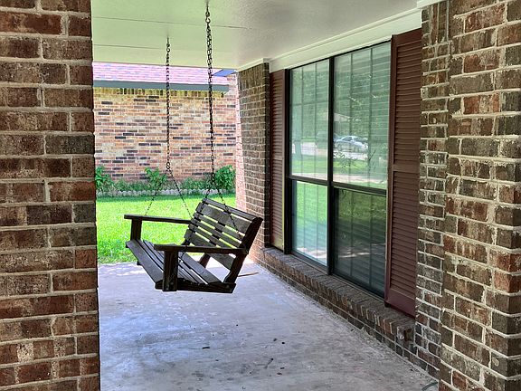 Front porch swing on covered front porch, great place for morning coffee!