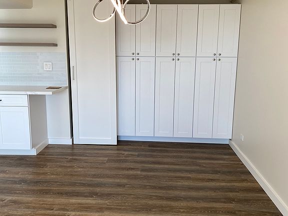 Lots of storage there is a full w/d behind that white barn door