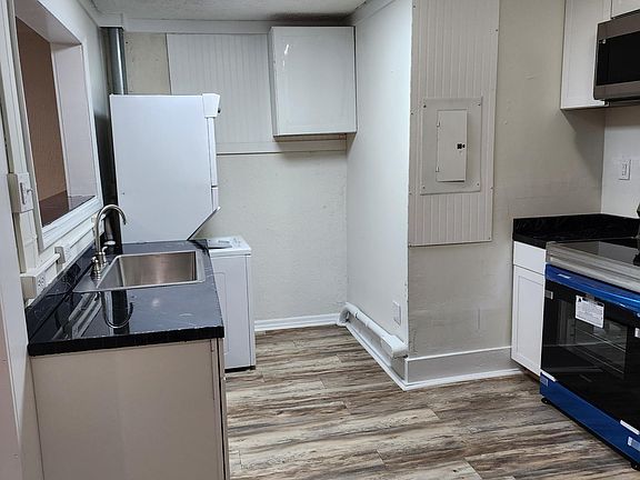 Kitchen with washer and dryer