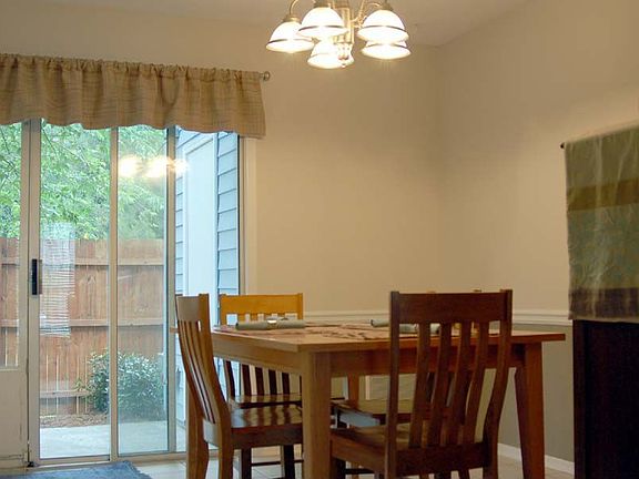 Dining Room is spacious and light with tile floors and views to private patio!