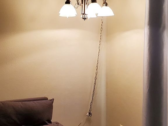 Sofa convertible to full bed with coffee table. Sofa has convenient cup holders and wifi plug-in.