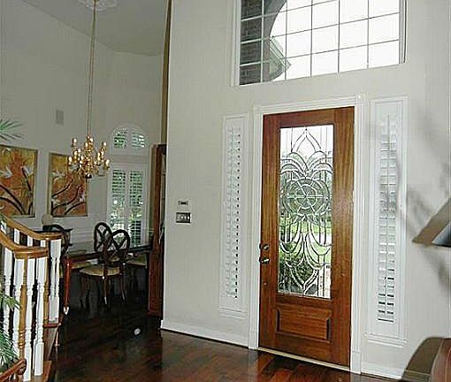 High ceilings and real wood floors welcome you as you open the front door!