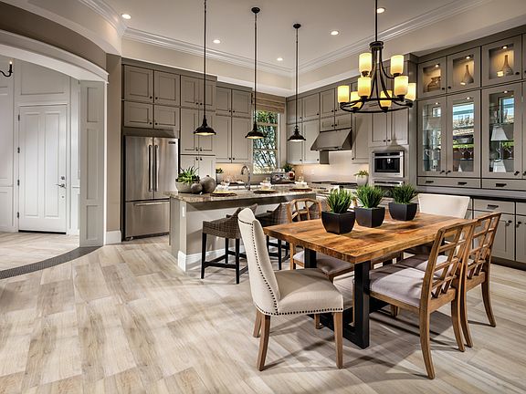Gourmet kitchen with countertop seating at the island