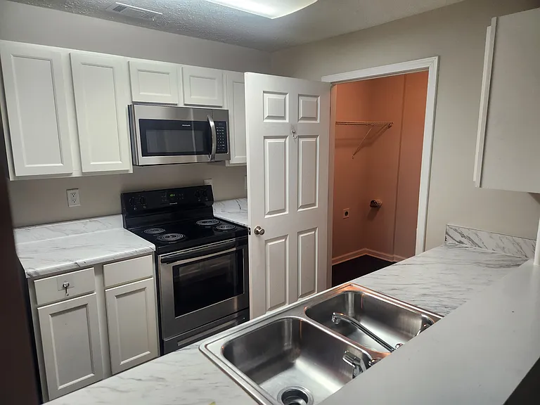 Access to the laundry-room from the kitchen. Washer & dryer included.
