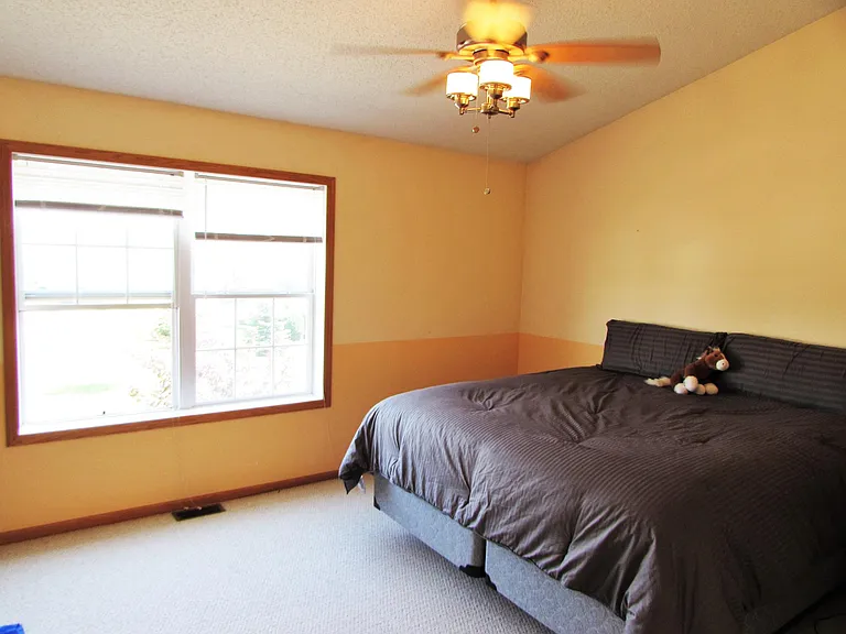 Master bedroom. King size bed fits easily. Vaulted ceiling