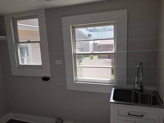 Sink in laundry room. Home back entrance comes into this room.