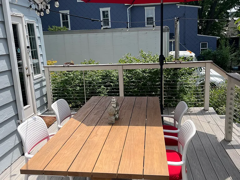 Dining deck just off the kitchen and the reading room. Table seats 8 people.
