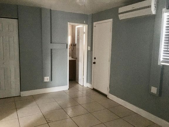 Bedroom has rear door