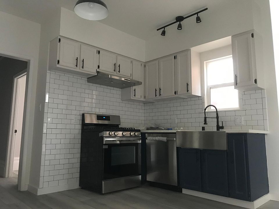 Updated kitchen. New range, dishwasher, vent, sink, and counters.