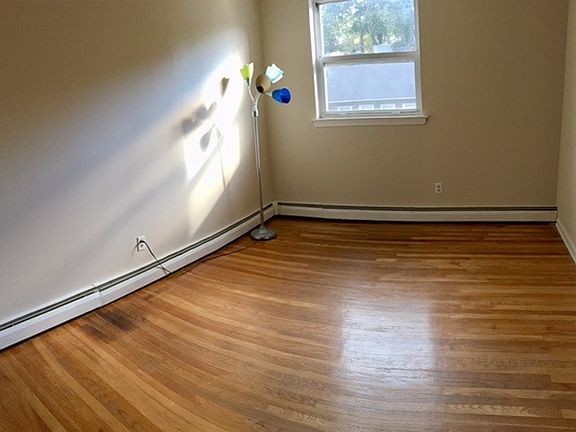 Bedroom with Window and Built-In Closet