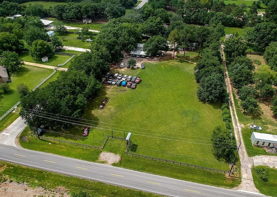 Beautiful property located on Boudreaux near 99 and Telge. Home with auto shop and a barn on over 2 acres!