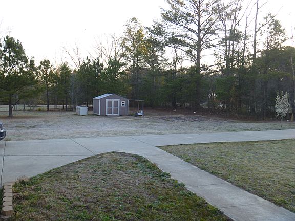 Storage Shed / Driveway