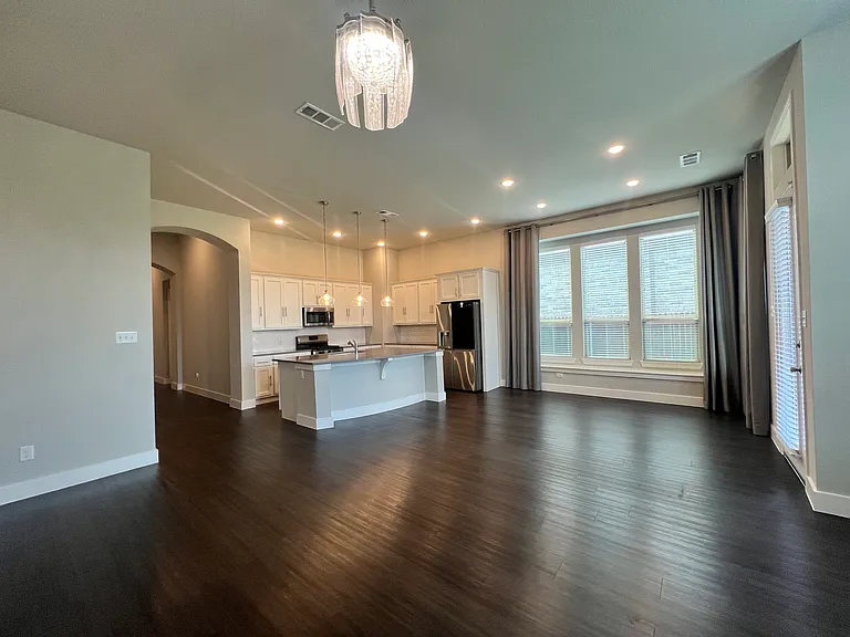 Kitchen, dining, and living area. Living area has fireplace.
