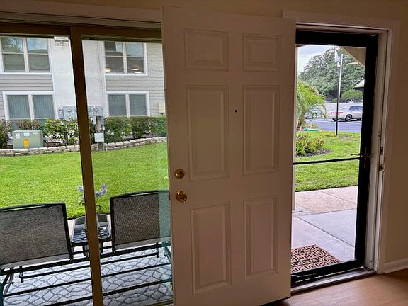 Taken from dining area showing new sliding glass doors and front porch