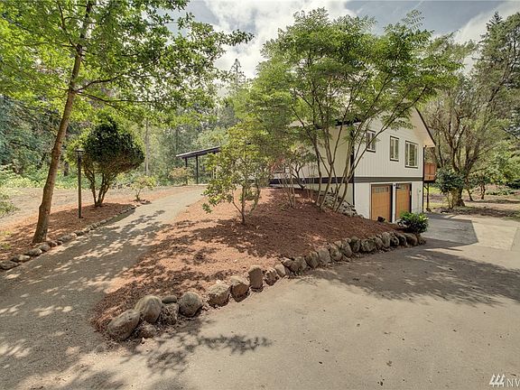 Path leading to the covered porch at the entry of the home. 