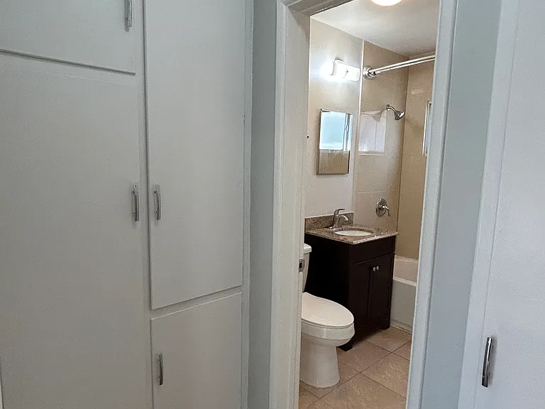 Hallway storage, entrance to bathroom