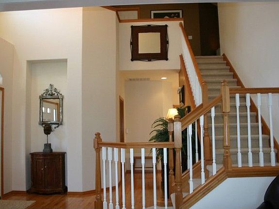 Dramatic entry with high vaulted ceilings and celestery window. Window conveniently has blind with r