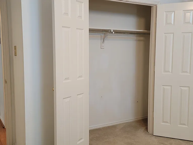 Inside bedroom 2 looking at closet. Bedroom 1 across hall