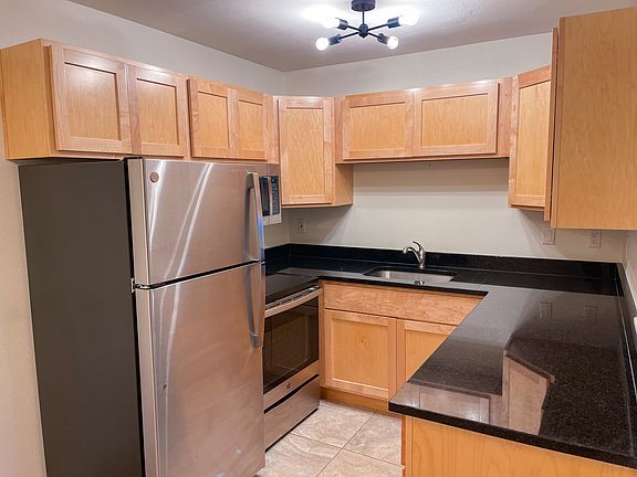 View of kitchen with stainless steel appliances.