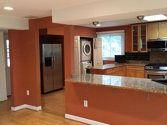 Family room looking into the kitchen (washer & dryer)