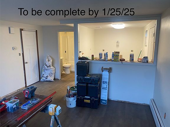 Studio/Bedroom - looking toward kitchen 

Remaining work to complete: wall trim, paint touchup