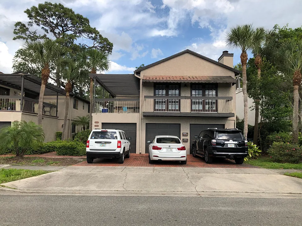 Front View, unit is upstairs. 2-car garage & driveway parking.