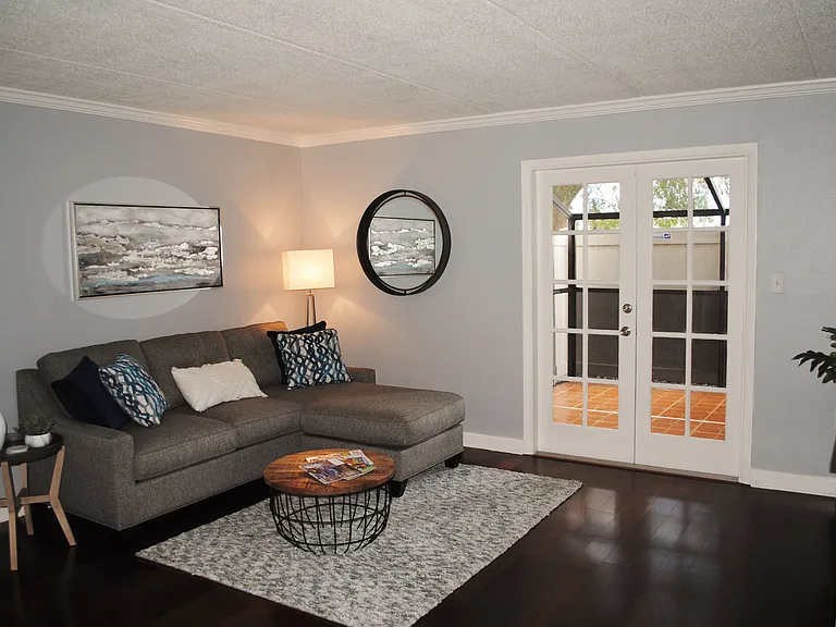 Living room with the French doors to the screened patio