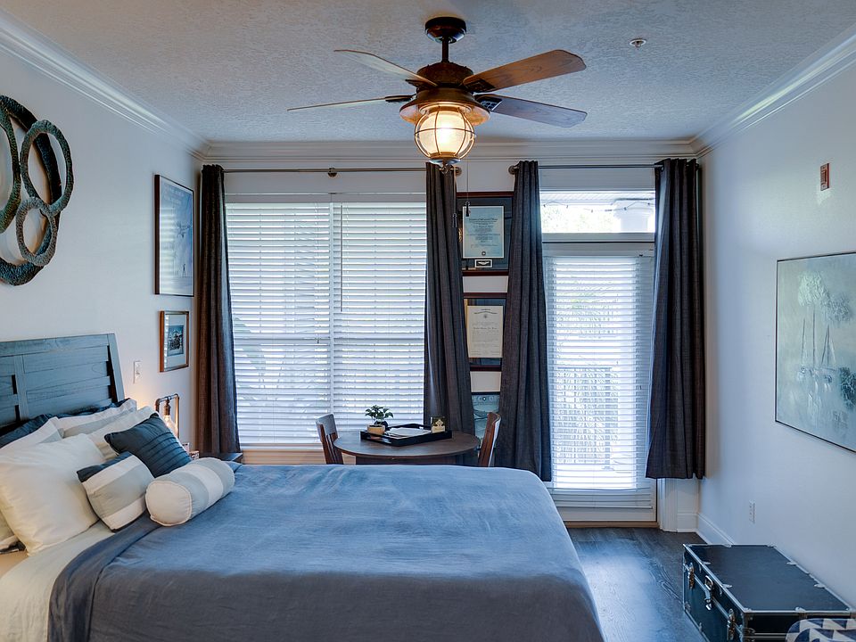 Primary bedroom with balcony access and views