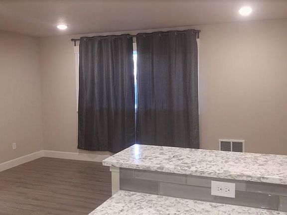 Spacious living area with harwoods