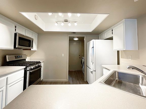 Updated Kitchen with New Countertops, New Microwave, and Newish Stove