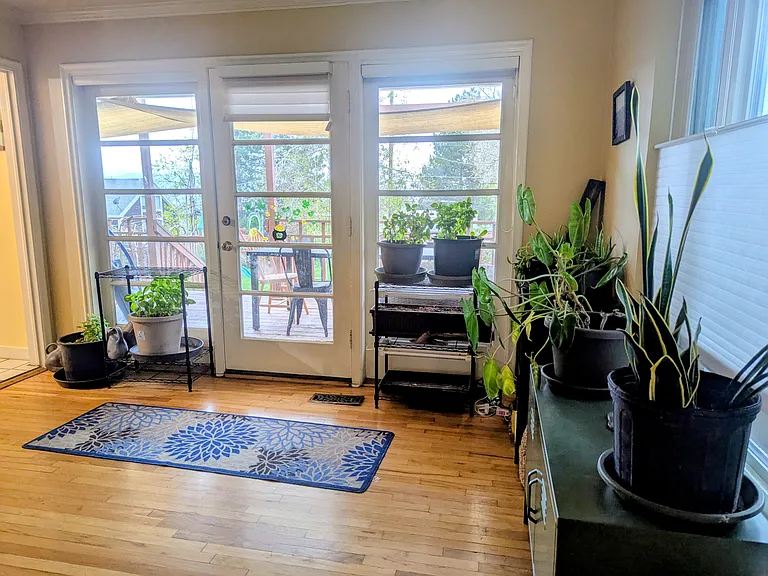 Room off kitchen with view of back porch