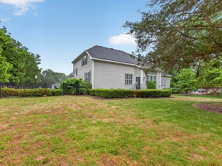 Manicured landscaping, fenced in backyard and large concrete patio