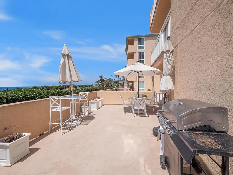 oceanfront patio with ocean to the left