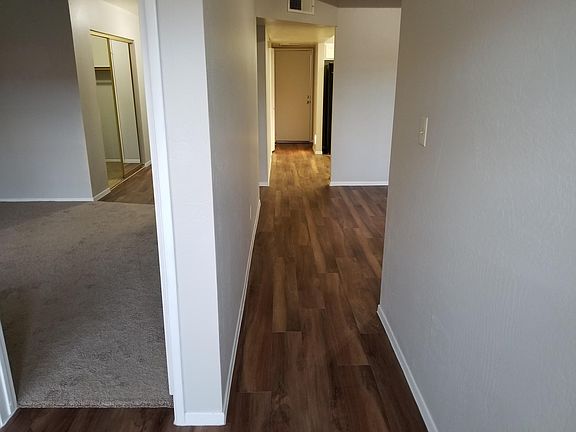 Master bedroom on the left, hall from bonus room looking at garage door.