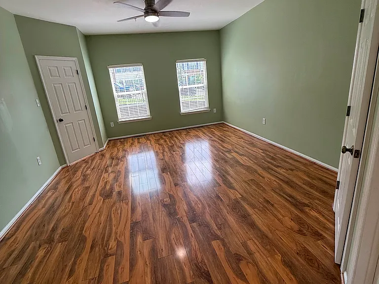 The spacious primary bathroom features a dual-sink vanity with ample counter space, generous storage, and a private tub and shower area_designed for both comfort and convenience.