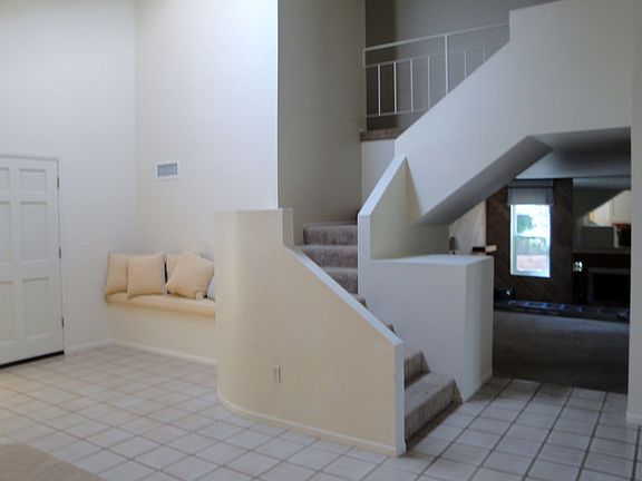 Entry with dramatic staircase