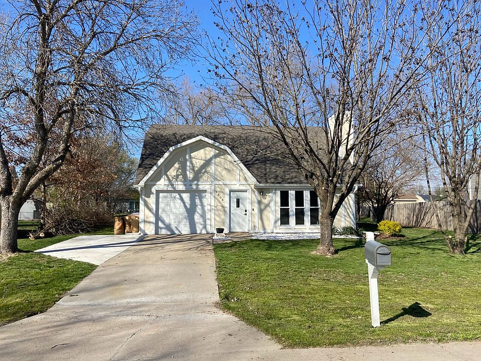 recently renovated exterior with landscaping and driveway extension
