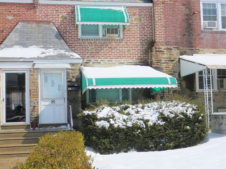 Covered patio outside and small lawn