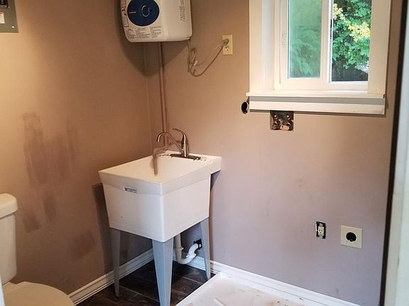 porch 1/2 bath and full size washer/dryer hookup