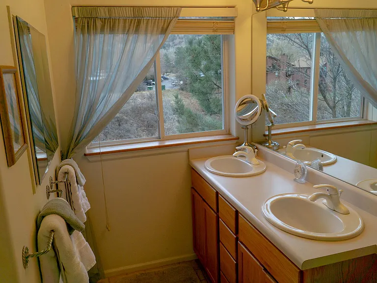 Primary bathroom. Includes tub/shower combo, double sinks w/storage.