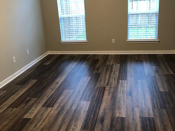 Master bedroom. There is a bathroom with a jacuzzi tub, double sinks and toilet. A large walk in closet and laundry room are off this room. (Washer and dryer are included.)