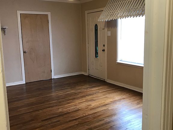 The interior awning has been removed. The floors are wooden throughout except in the kitchen which is ceramic tile.