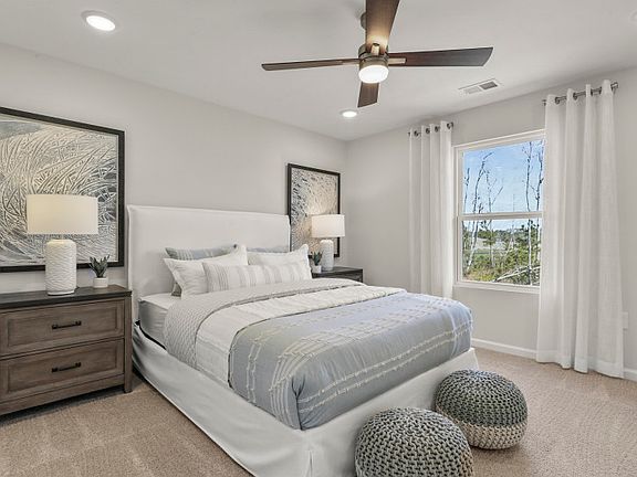 Relax in this cozy guest room with decorative lighting.