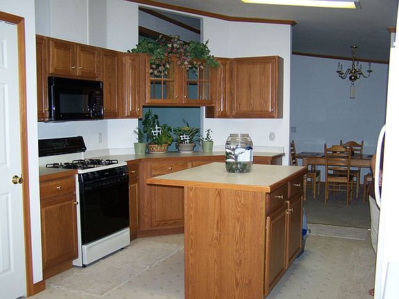 Oak kitchen with island and pass-thru