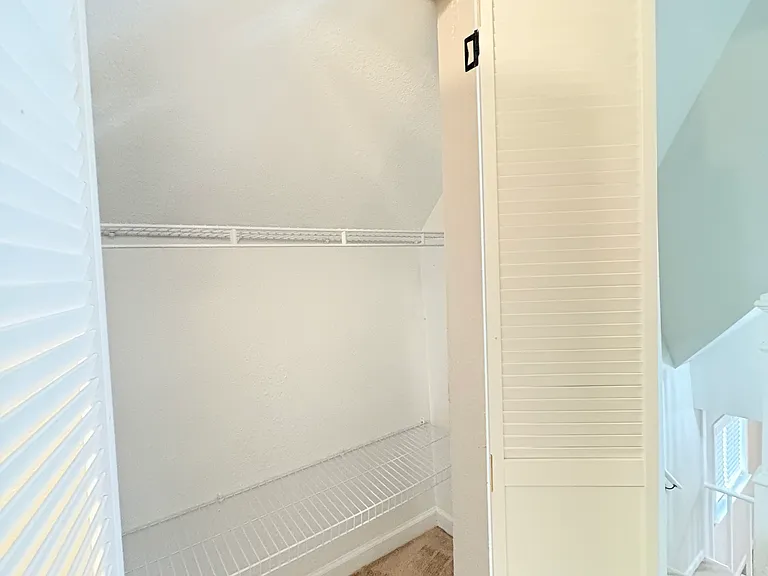 Hallway storage provides convenient space for linens, games, and other household items.