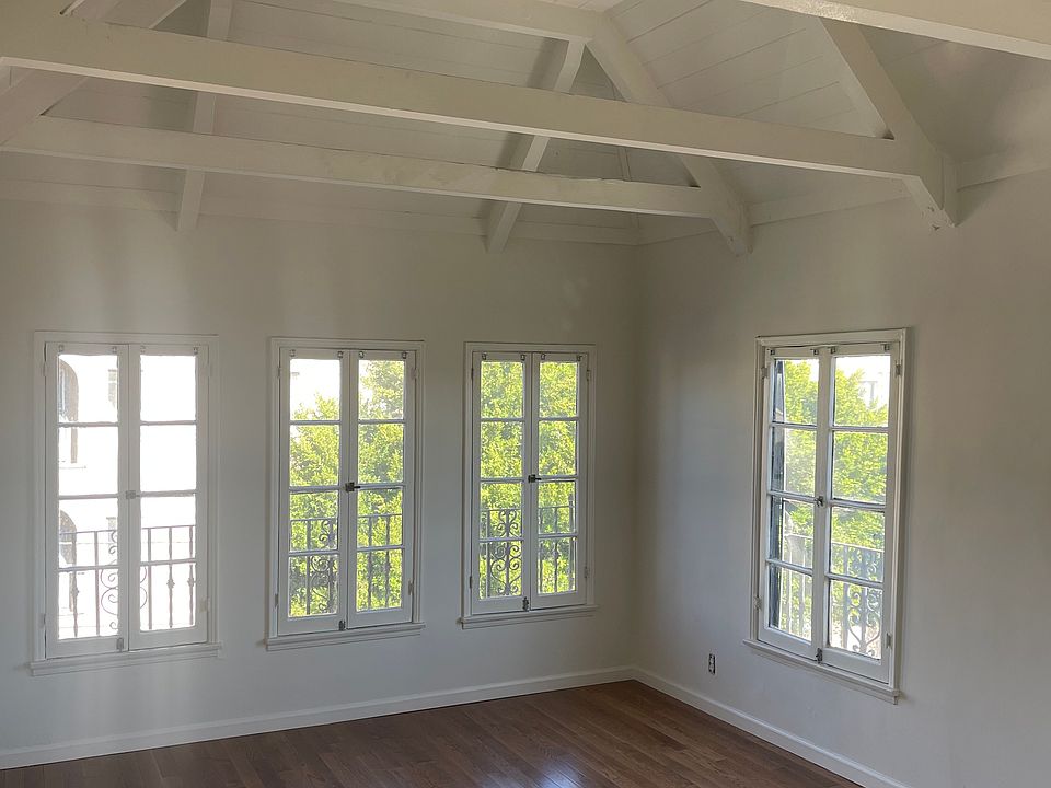 Living room with vaulted, beamed ceiling, view of Hollywood sign, ceiling fan/light - LOTS OF LIGHT