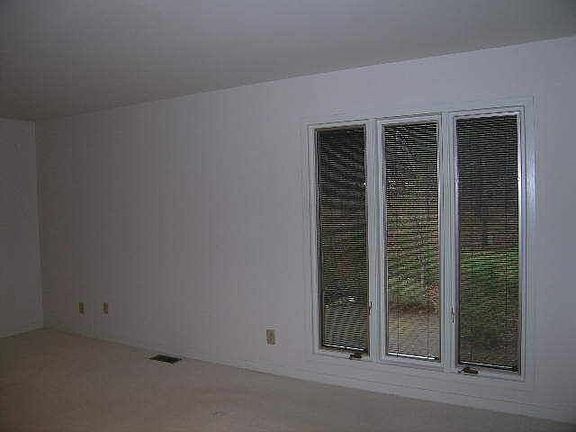 Master bedroom window overlooking wooded back yard
