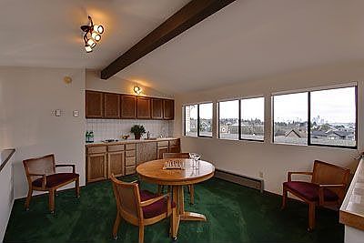Game room with view of Downtown Seattle & Elliott Bay.